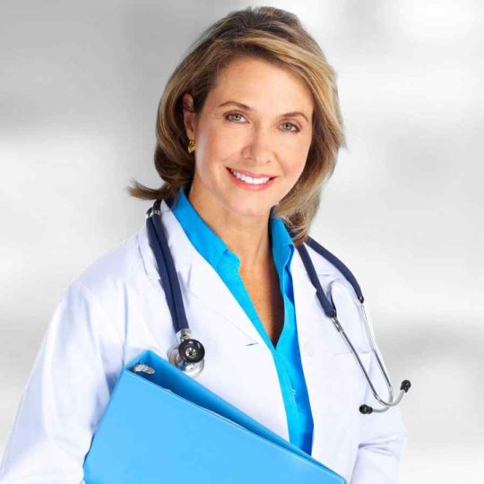 Smiling female doctor with stethoscope and clipboard.