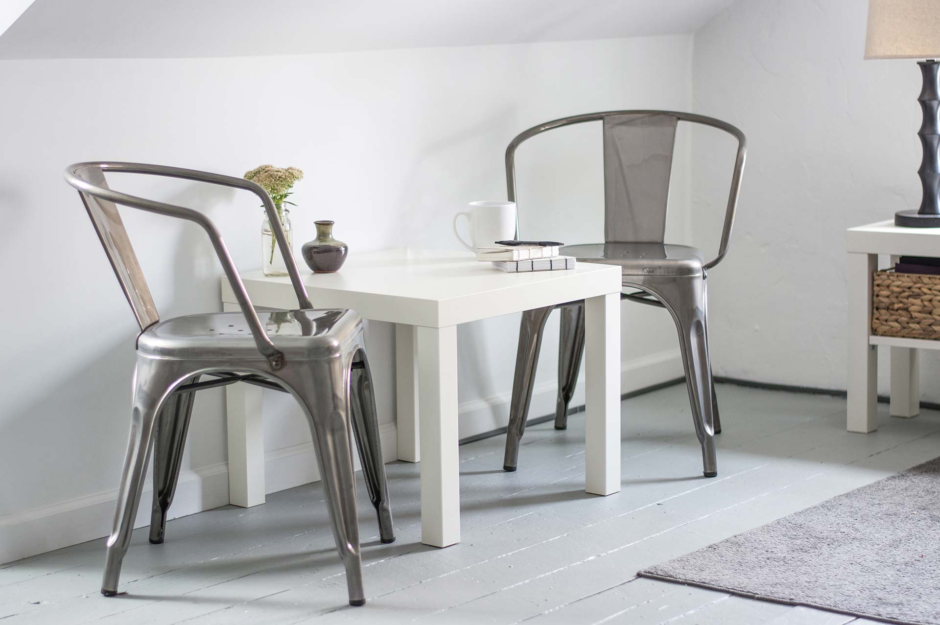 Minimalist dining area with metal chairs.
