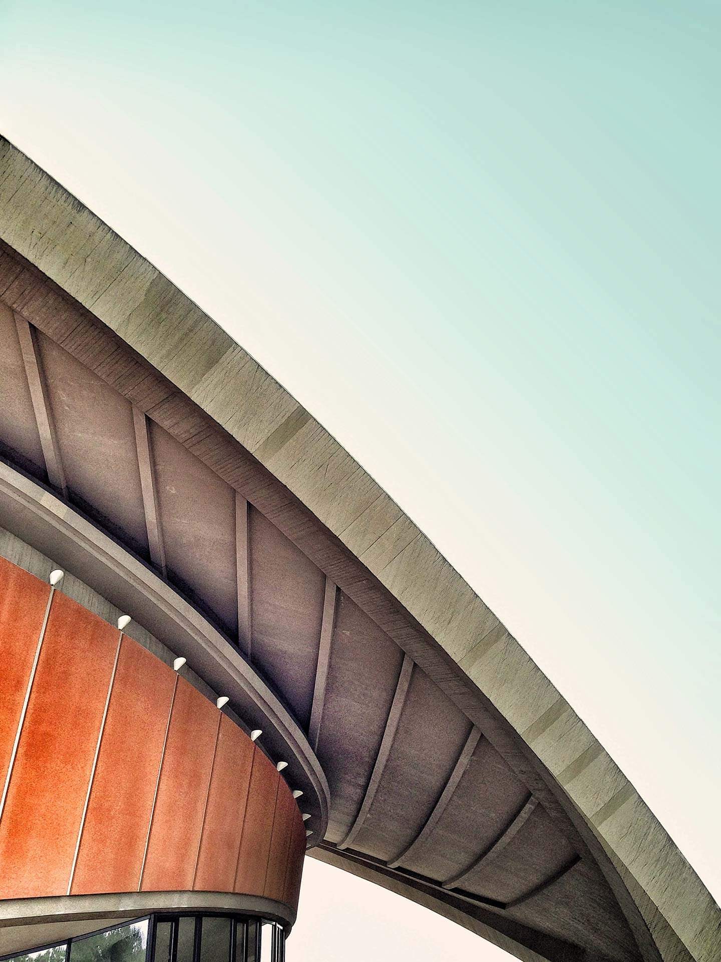 Modern architectural building with curved roof.
